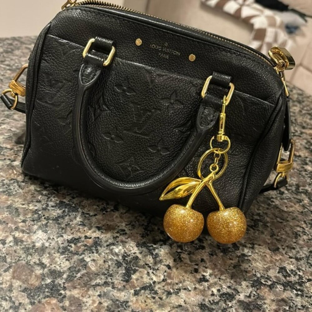 The Gabriella Gold and gold glitter cherry keychain for bag or keys